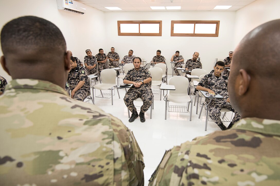 Students sit in a classroom.