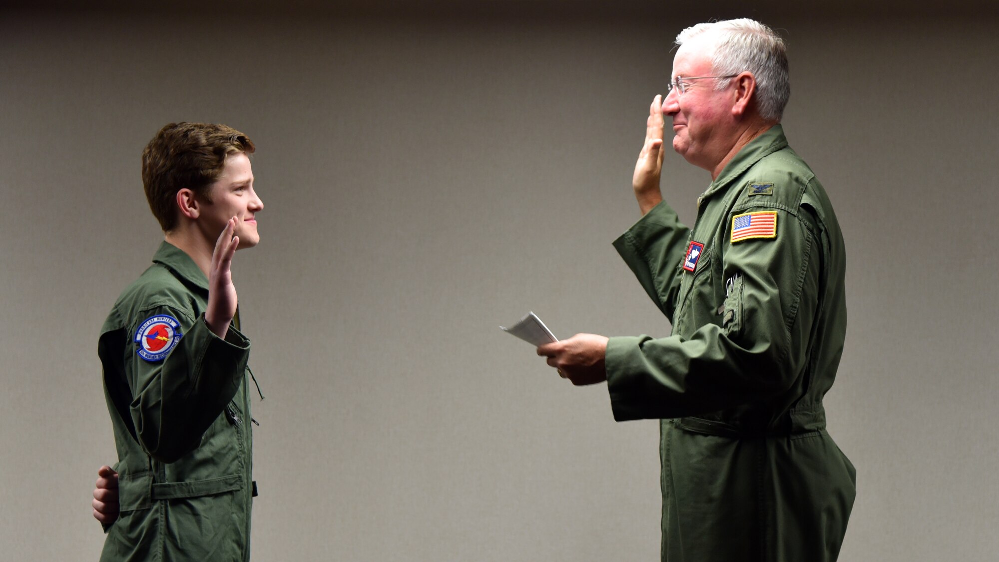 Col. Jeffrey A. Van Dootingh, 403rd Wing commander, commissions honorary 2nd Lt. Charles “Payton” Burge, of Carriere, Mississippi, during the Pilot for a Day program Dec. 19, at Keesler Air Force Base, Miss. The 403rd Wing collaborated with Make A Wish Mississippi who selects the children who will participate in the Program. (U.S. Air Force photo by Lt. Col. Marnee A.C. Losurdo)