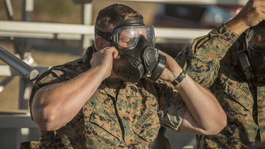 U.S. Marine Corps Master Sgt. Joshua R. Kirchem, a Marine with the 13th Marine Expeditionary Unit, I Marine Expeditionary Force, adjusts his M61 gas mask before the annual chemical, biological, radiological, and nuclear defense training at Marine Corps Base Camp Pendleton, Calif., October 24, 2019.