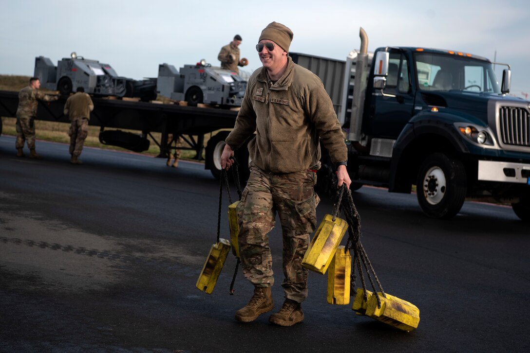 U.S. Air Force Staff Sgt. Justin Cwalinski, 52nd Aircraft Maintenance Squadron aerospace propulsion craftsman, prepares to recover an F-16 Fighting Falcon at Spangdahlem Air Base, Germany, Dec. 17, 2019. A small team of Airmen recovered and launched multiple F-16s during a Agile Combat Employment exercise. ACE allows U.S. Air Forces in Europe to operate from various locations, with varying levels of capacity and support, to ensure Airmen are postured to deliver lethal combat power. (U.S. Air Force photo by Airman 1st Class Valerie Seelye)