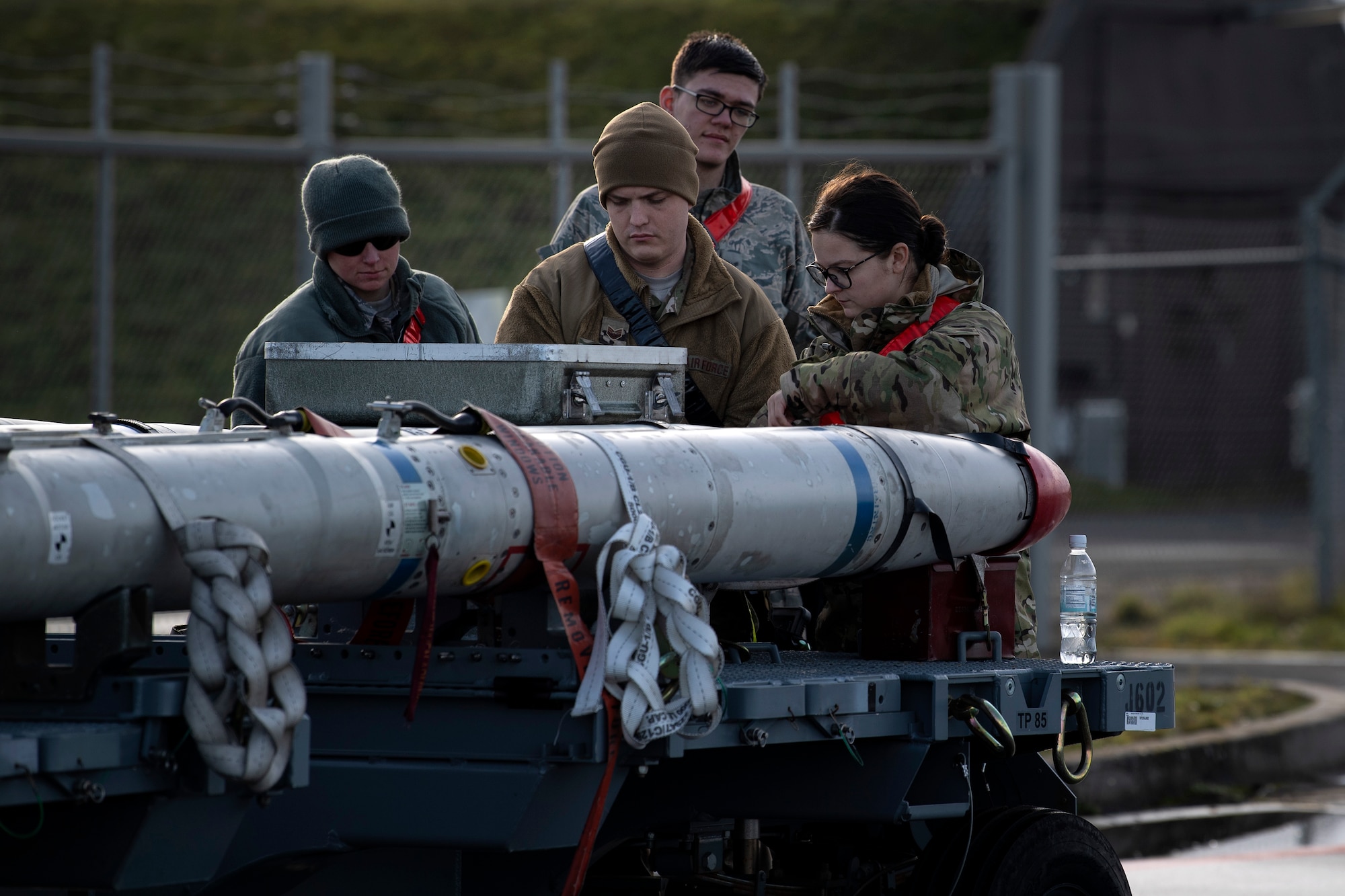 U.S. Air Force Airmen from the 52nd Fighter Wing check munitions for rust or other discrepancies on the flightline at Spangdahlem Air Base, Germany, Dec. 17, 2019. The Airmen conducted an Agile Combat Employment exercise, which is a timely, proactive operation to increase survivability while generating airpower. The event challenged personnel to support operations in a simulated adverse environment with minimal people, resources, and time. (U.S. Air Force photo by Airman 1st Class Valerie Seelye)