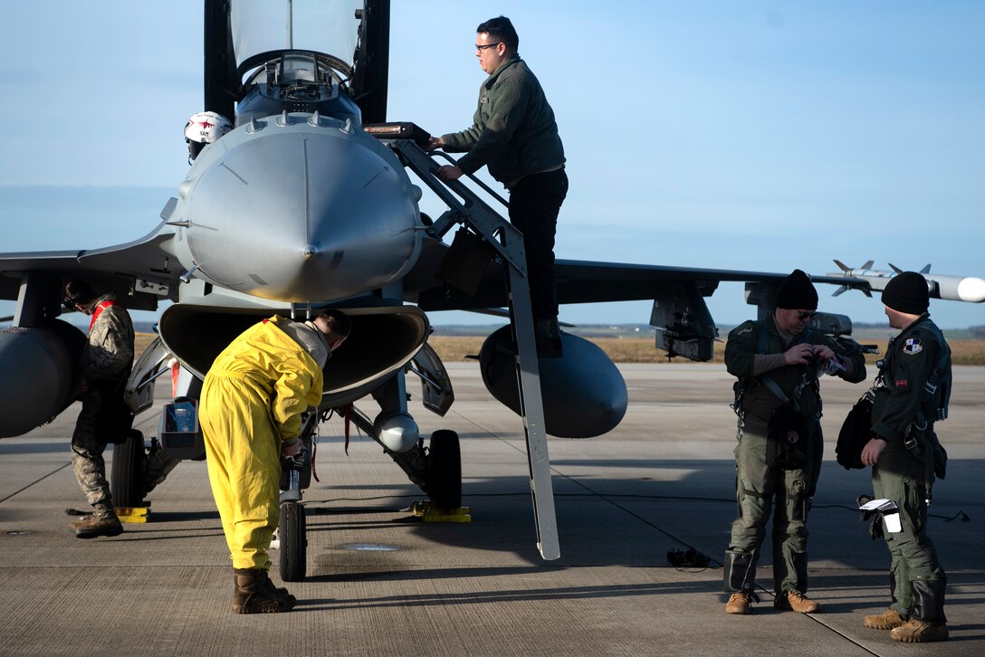 U.S. Air Force Airmen from the 52nd Fighter Wing recover an F-16 Fighting Falcon at Spangdahlem Air Base, Germany, Dec. 17, 2019. A small team of Airmen recovered and launched multiple F-16s during an Agile Combat Employment exercise on the flightline. The wing is scheduled to routinely conduct ACE operations in order to practice generating airpower in a contested environment. (U.S. Air Force photo by Airman 1st Class Valerie Seelye)
