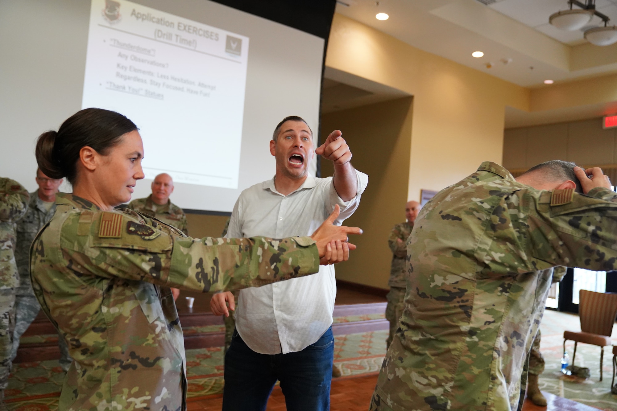 U.S. Air Force Col. Heather Blackwell, 81st Training Wing commander, BJ Lange, Wounded Warrior Project comedy coach participate in an activity for the 'Improv to Improve' course in the Bay Breeze Event Center at Keesler Air Force Base, Mississippi, Dec. 10, 2019. Improv to Improve is an improvisation comedy resiliency class that engages military members in a safe interactive learning environment. The purpose of the class is to help combat life stress and adversity in an unconventional way. (U.S. Air Force photo by Airman 1st Class Spencer Tobler)
