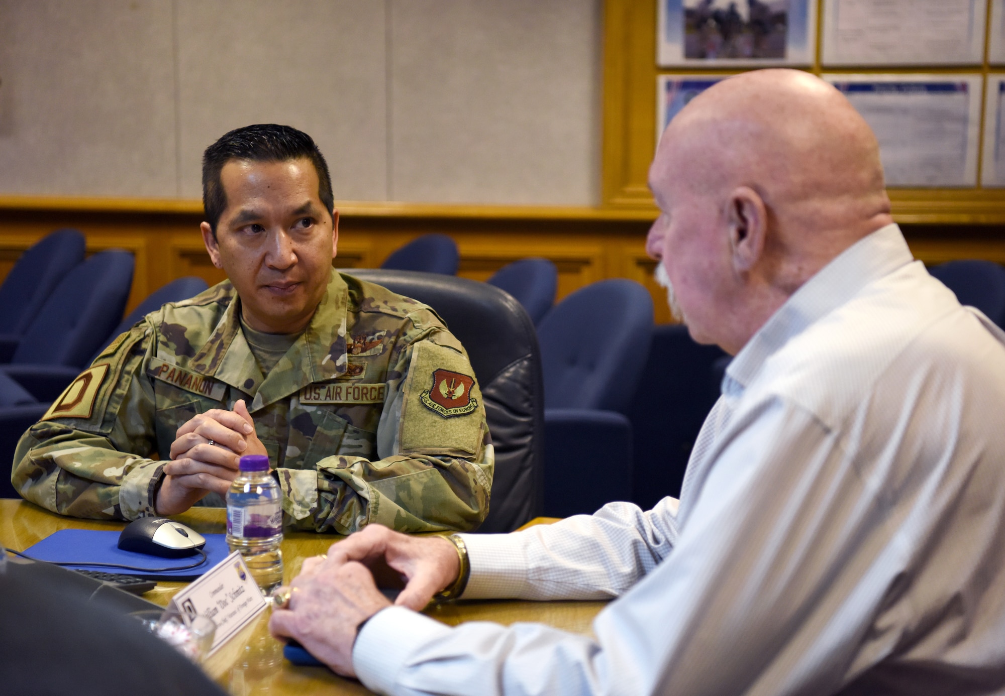 Colonel Troy Pananon, 100th Air Refueling Wing commander, discusses Team Mildenhall’s mission sets with William “Doc” Schmitz, Commander-in-Chief for Veterans for Foreign Wars, at RAF Mildenhall, England, Dec. 18, 2019. During his visit, Schmitz toured base facilities and spoke to Airmen about their mission. (U.S. Air Force photo by Senior Airman Brandon Esau)
