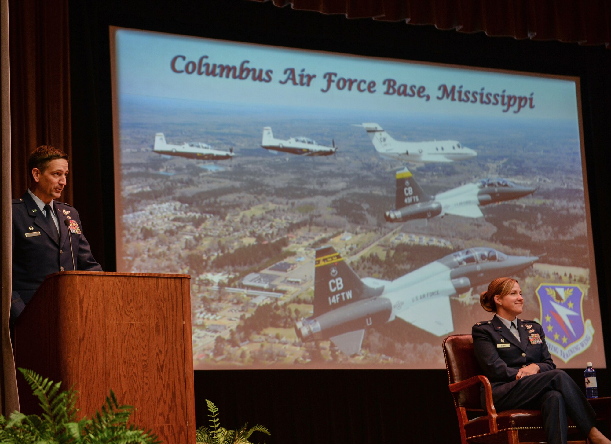 Col. Stephen Hodge, 314th Airlift Wing commander, delivers a speech at the graduation ceremony of Specialized Undergraduate Pilot Training Class 20-04/05, Dec. 13, 2019, at Columbus Air Force Base, Miss. Hodge referenced Air Force heroes such as Col. John Boyd and Lt. Col. William Boyd Jr. during his speech. (U.S. Air Force photo by Airman Davis Donaldson)