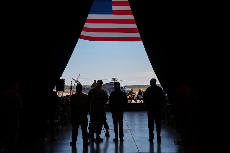 Airmen watch speaker at MH-139 naming ceremony,