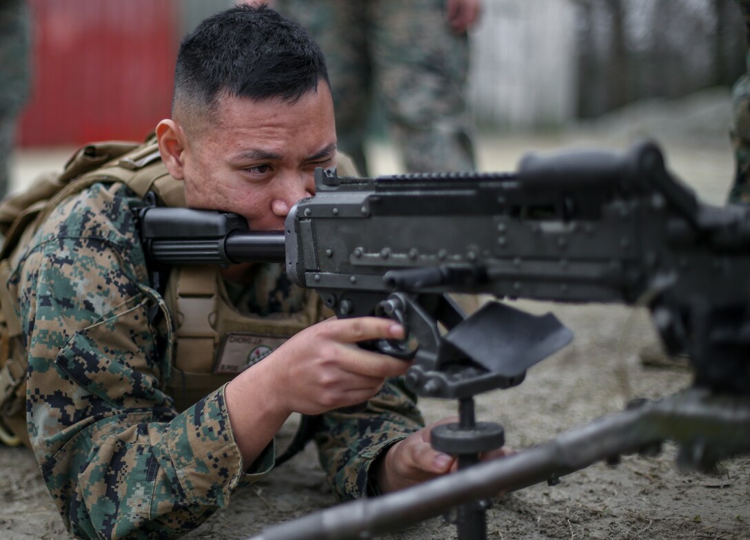 U.S. Marine Corps Cpl. Jai Chong, a maintenance management specialist with Headquarters Company, 6th Marine Regiment, 2nd Marine Division, practices clearing procedures on an M240B Machine Gun during a basic skills training range at Camp Geiger, N.C., Dec. 17, 2019. The training ensures that every Marine in the regiment is capable of completing the mission regardless of occupation. (U.S. Marine Corps photo by Lance Cpl. Brian Bolin Jr.)