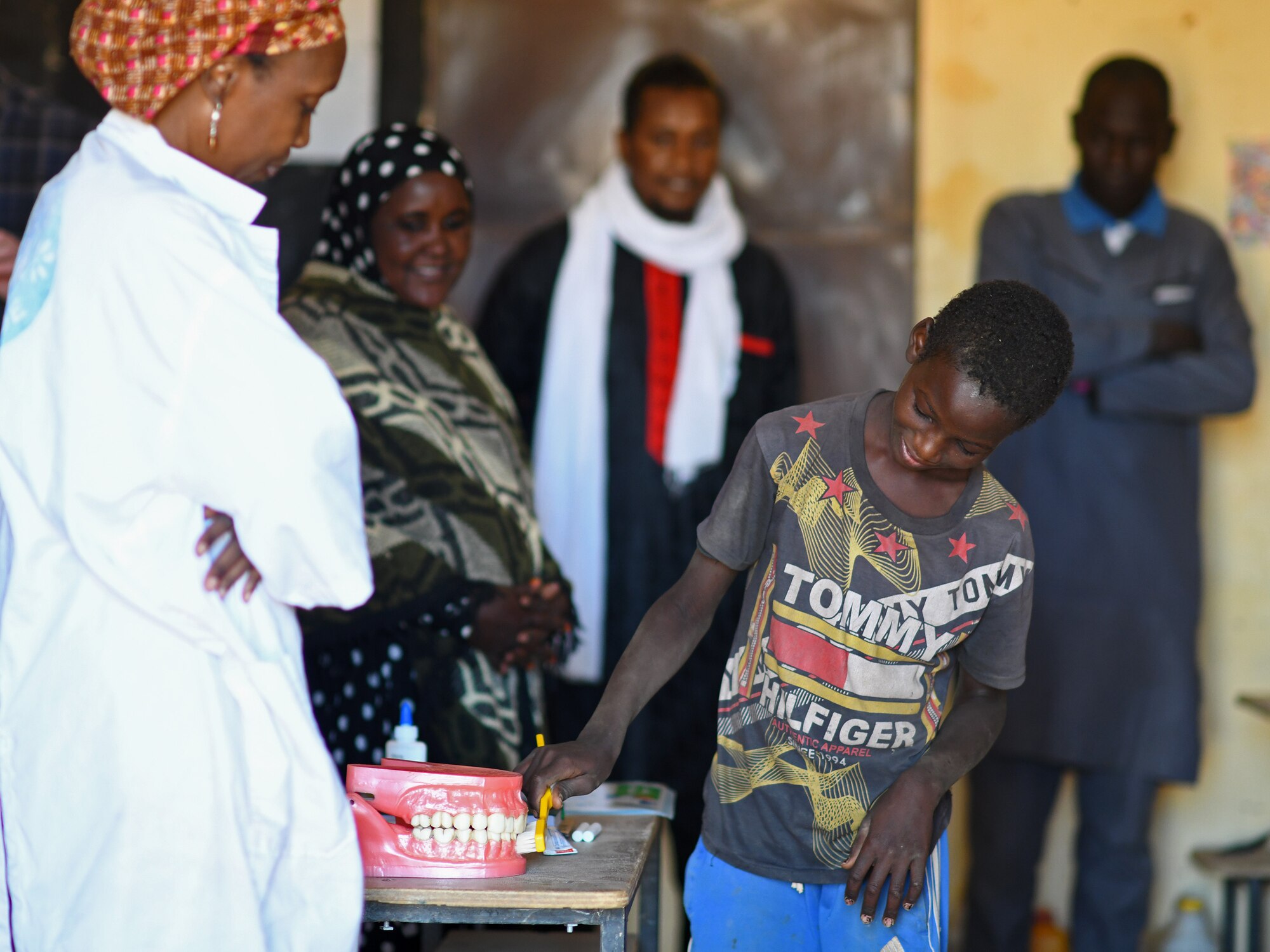 A local student learns how to brush his teeth during a dental hygiene course in the village of Tsakatalam, Niger, Dec. 14, 2019. The U.S. Army 443rd Civil Affairs Battalion Civil Affairs Team 219 deployed to Nigerien Air Base 201 partnered with local Agadez city dentist, Dr. Mahaman Aicha, to teach the Tsakatalam Primary School students for the first time how to properly brush and floss their teeth and the importance of good oral health. (U.S. Air Force photo by Staff Sgt. Alex Fox Echols III)