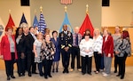16 Civilian retirees pose with the Defense Logistics Agency Troop Support commander at a retirement ceremony.