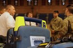 Members of the 33rd Civil Support Team brief Maj. Gen. Olivier Kim, Chief of the French Gendarmerie Reserves Command, at the District of Columbia National Guard’s Armory Dec. 11.