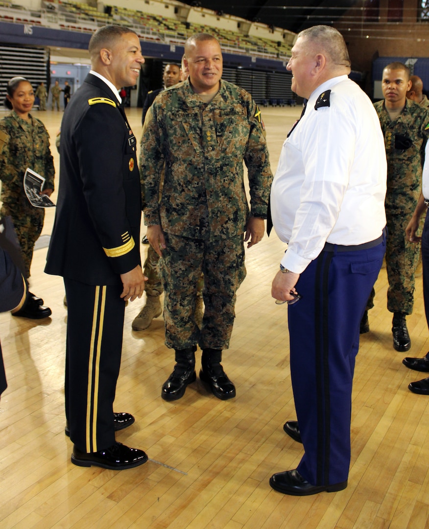 Brig. Gen. Aaron R. Dean, the Adjutant General of the District of Columbia National Guard, introduces Lt. Col. Sydney Powell, Jamaica Defence Force with the Health Services Corps, to Maj. Gen. Olivier Kim, Chief of the French Gendarmerie Reserves Command at the DCNG Armory Dec. 11.