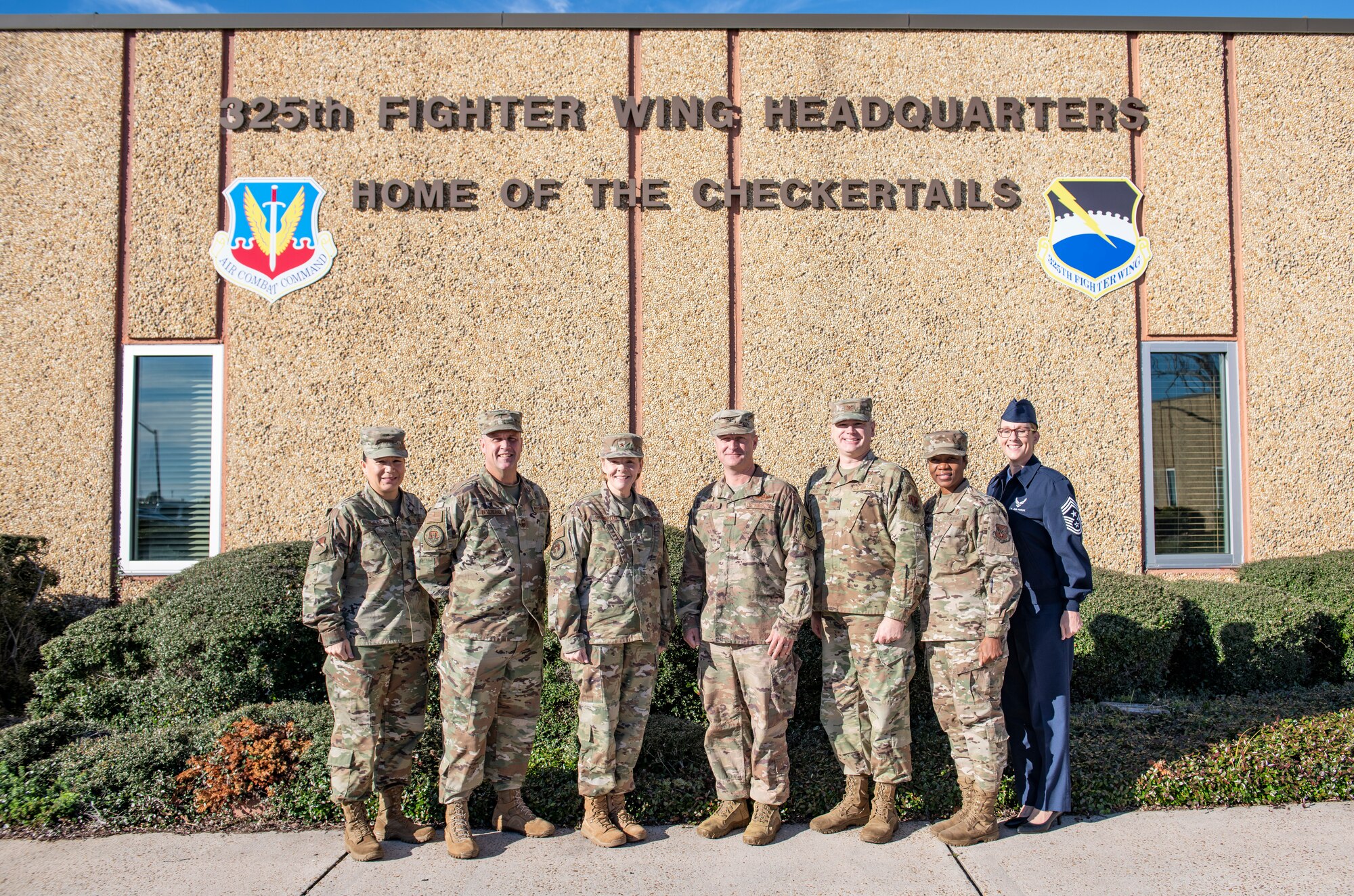 U.S. Air Force Brig. Gen. Sharon Bannister, Air Combat Command Surgeon General, center, poses for a photo with U.S. Air Force Col. Brian Laidlaw, 325th Fighter Wing commander, right, at Tyndall Air Force Base, Florida, Dec. 19, 2019. Bannister toured the 325th Medical Group and met with Airmen, responded to questions, and viewed facilities currently operational. (U.S. Air Force photo by Senior Airman Stefan Alvarez)