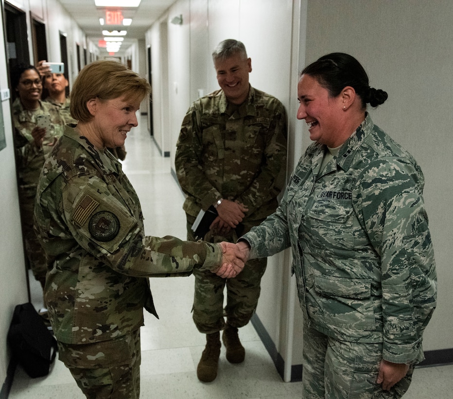 U.S. Air Force Brig. Gen. Sharon Bannister, Air Combat Command Surgeon General, left, coins U.S. Air Force Capt. Tanya Capper, 325th Operational Medical Readiness Squadron primary care flight commander, at Tyndall Air Force Base, Florida, Dec. 18, 2019. Capper was coined by Bannister for her hard work ethic and ability to mitigate and manage an ever-changing medical environment. (U.S. Air Force photo by Staff Sgt. Magen M. Reeves)