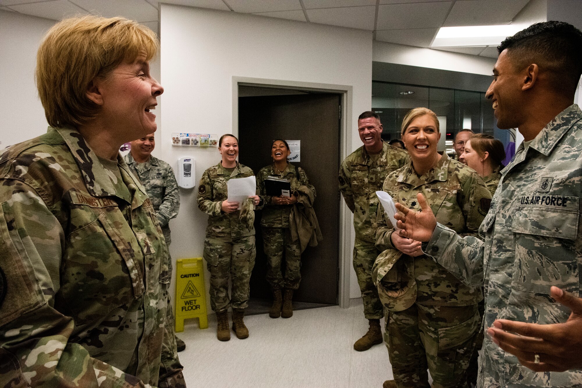U.S. Air Force Brig. Gen. Sharon Bannister, Air Combat Command Surgeon General, left, laughs with U.S. Air Force Staff Sgt. Jadow Hughes, 325th Medical Support Squadron laboratory specialist, right, at Tyndall Air Force Base, Florida, Dec. 18, 2019. The lab had been severely undermanned for several months, mostly supported by civilian employees and Hughes, while they balanced operational needs and minimal staffing. (U.S. Air Force photo by Staff Sgt. Magen M. Reeves)
