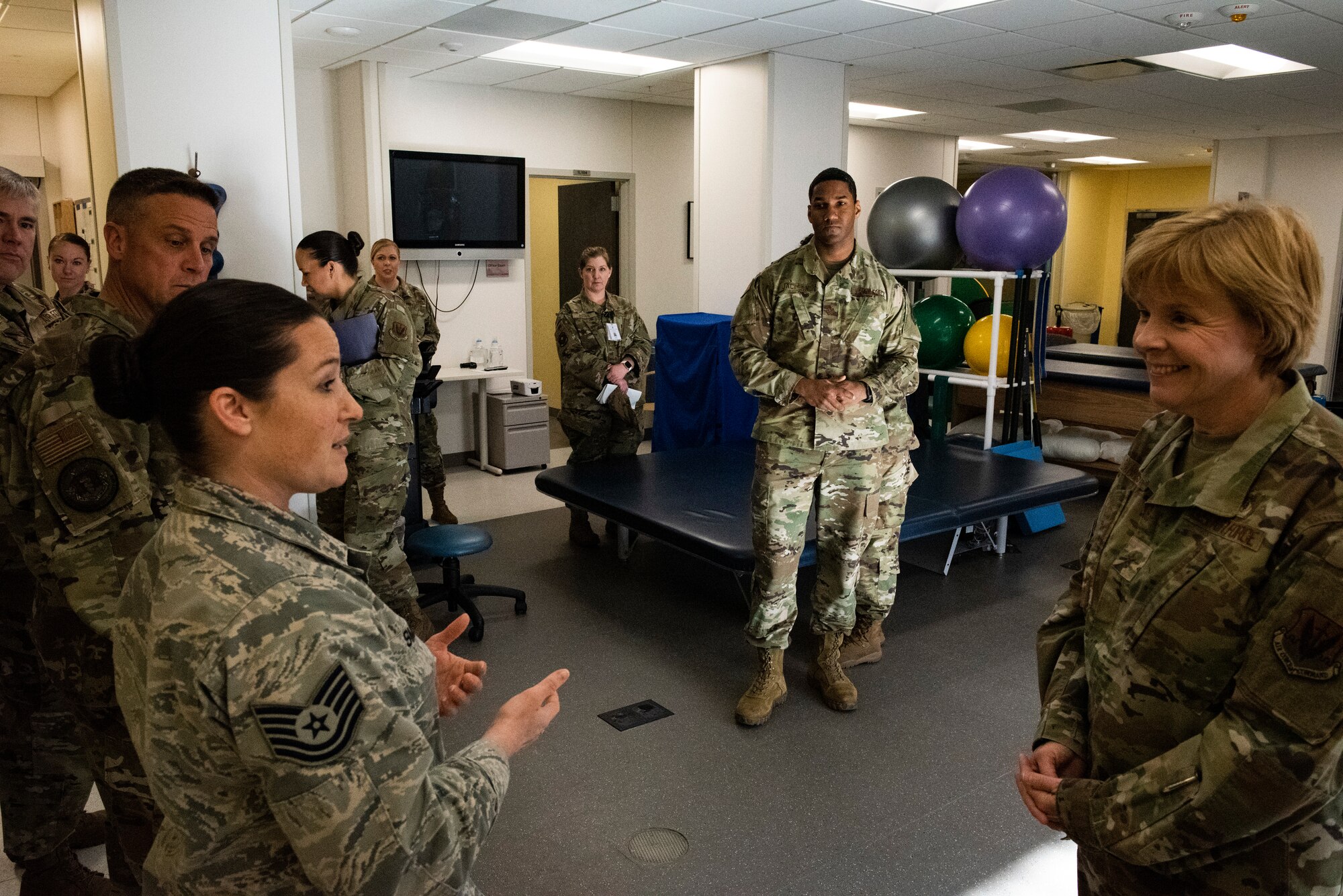 U.S. Air Force Tech. Sgt. Jody Smen, 325th Operational Medical Readiness Squadron, left, gives a capability briefing to U.S. Air Force Brig. Gen. Sharon Bannister, Air Combat Command Surgeon General, right, at Tyndall Air Force Base, Florida, Dec. 19, 2019. The 325th Medical Group had recently reopened the physical therapy department and resumed patient care in-house. (U.S. Air Force photo by Staff Sgt. Magen M. Reeves)