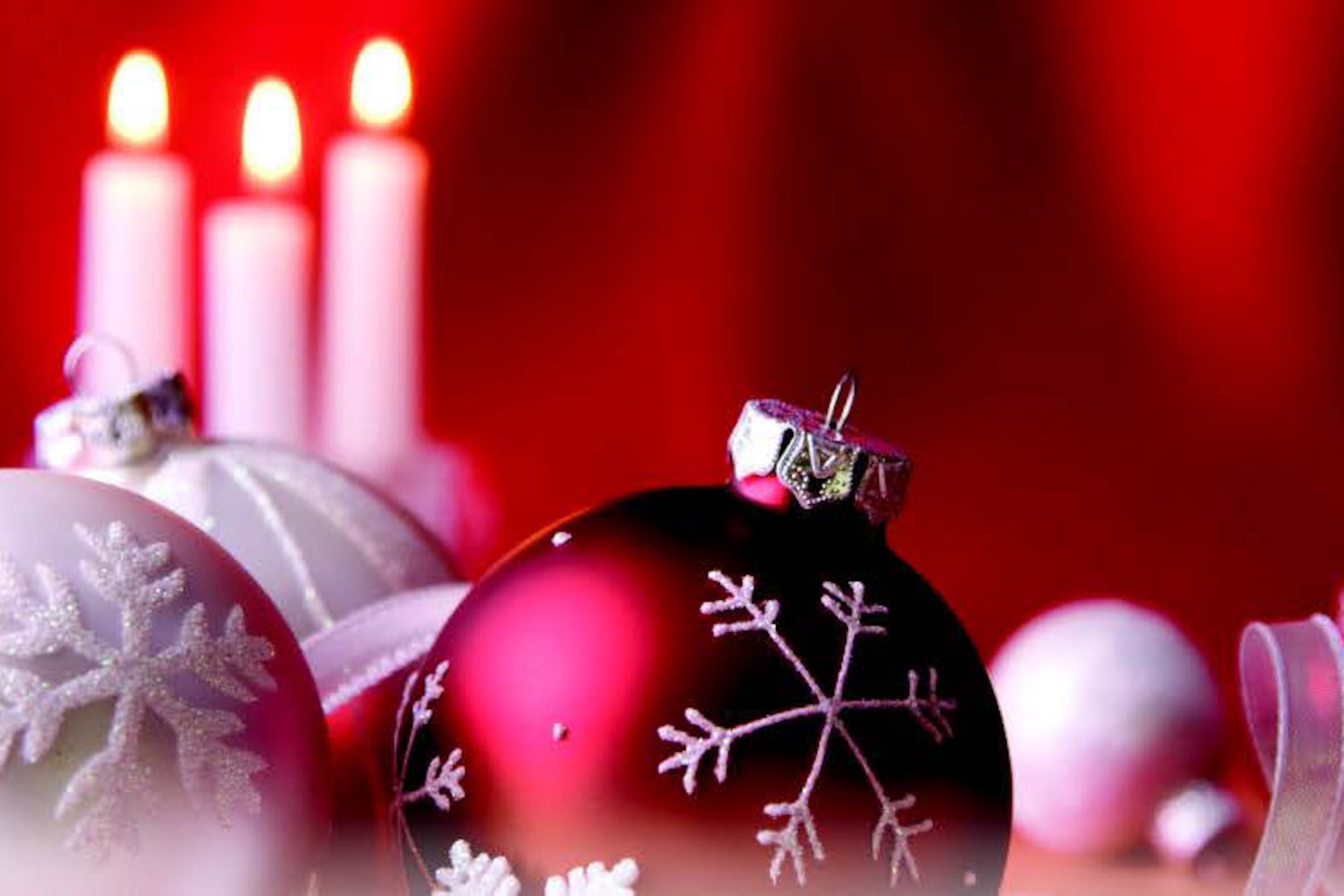 A photo of holiday ornaments and candles.