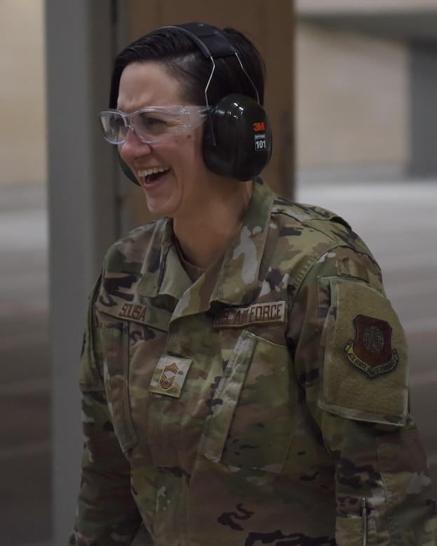 Chief Master Sgt. Jeannie Sousa, 460th Medical Group superintendent, smiles after she finished firing at the firing range at the 460th Security Forces Combat Arms Training and Maintenance Facility at Buckley Air Force Base, Colo., Dec. 19, 2019.