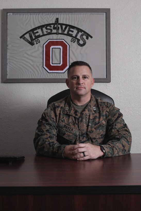 U.S. Marine Corps Capt. Richard A. Hayek, the 12th Marine Corps District adjutant, poses for a photo at his desk in San Diego, Calif., Dec. 19, 2019. Hayek was nominated for he award for various actions that exemplified leadership on and off the battlefield. (U.S. Marine Corps photo by Sgt. Christian Cachola)