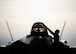 An Airman cleans the canopy of an F-35A Lighting II fighter jet.