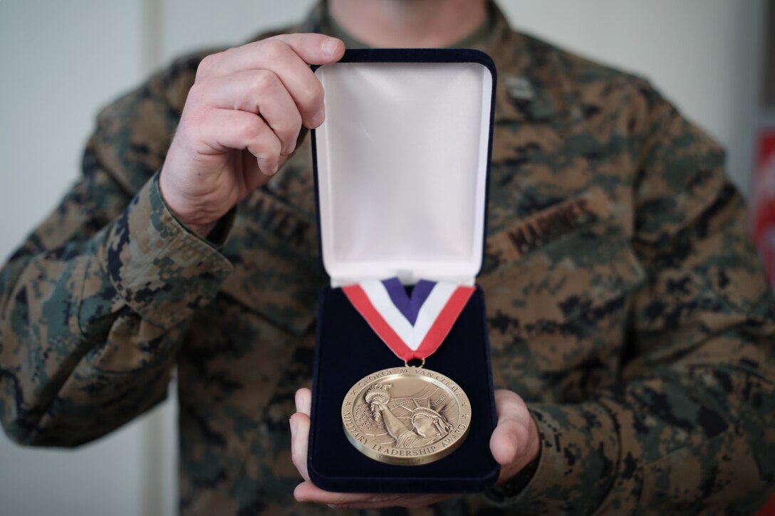 U.S. Marine Corps Capt. Richard A. Hayek, the 12th Marine Corps District adjutant, poses with the George Van Cleave Award medal for a photo in San Diego, Calif., Dec. 19, 2019. Hayek was nominated for he award for various actions that exemplified leadership on and off the battlefield. (U.S. Marine Corps photo by Sgt. Christian Cachola)