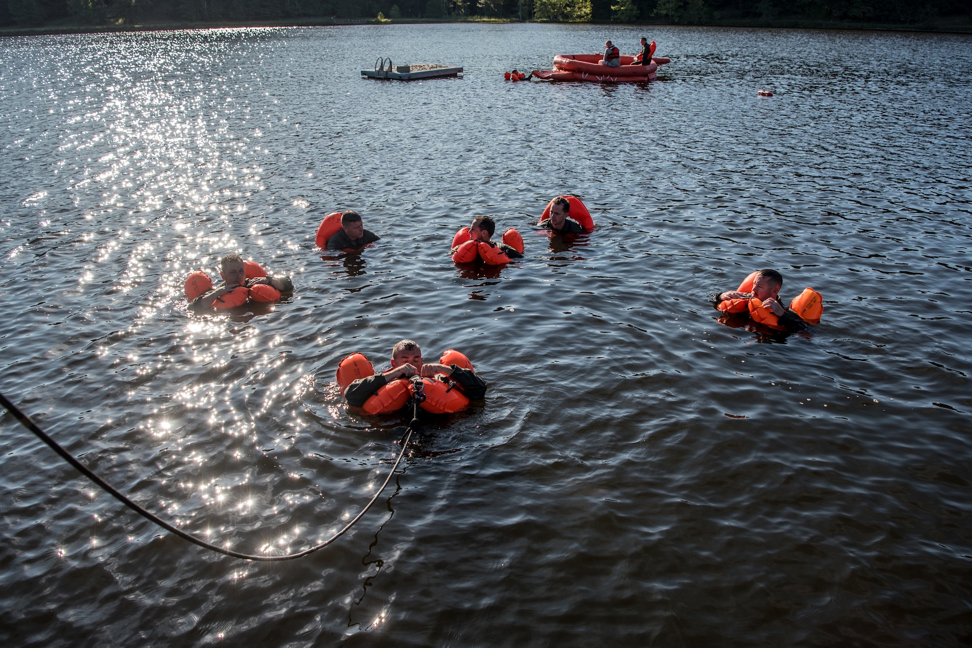Aircrew members from the Kentucky Air National Guard’s 123rd Airlift Wing are pulled to land after extricating themselves from underneath a floating parachute during water survival training at Camp Crooked Creek in Shepherdsville, Ky., Sept. 14, 2019. The training also covered land survival techniques and orienteering. (U.S. Air National Guard photo by Staff Sgt. Joshua Horton)