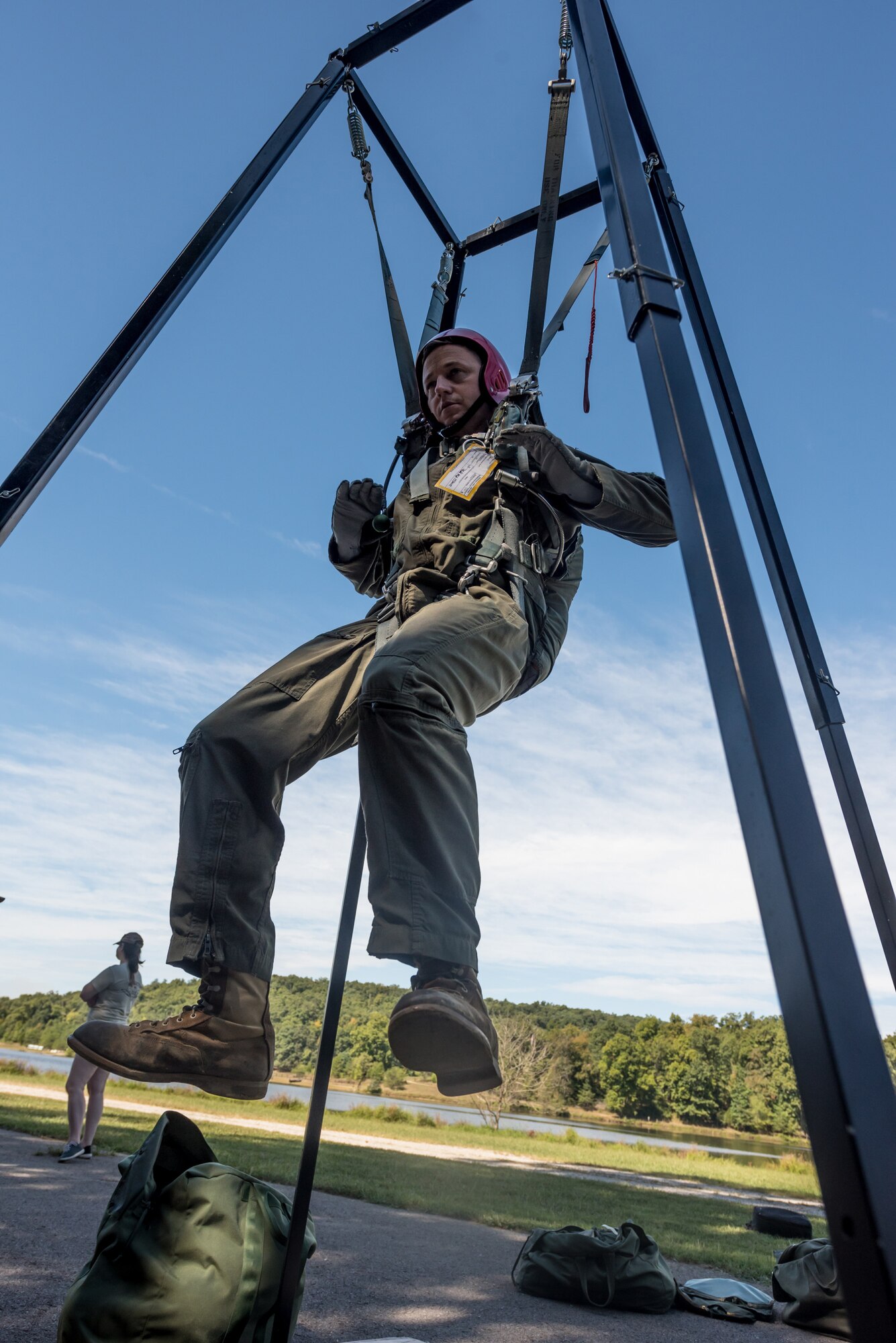 Tech. Sgt. Chris Johnson, a flight engineer for the Kentucky Air National Guard’s 165th Airlift Squadron, lowers himself from a training apparatus during survival training at Camp Crooked Creek in Shepherdsville, Ky., Sept. 14, 2019. The exercise is designed to train aircrew members on proper procedures should they become caught in a tree while parachuting to the ground. (U.S. Air National Guard photo by Staff Sgt. Joshua Horton)