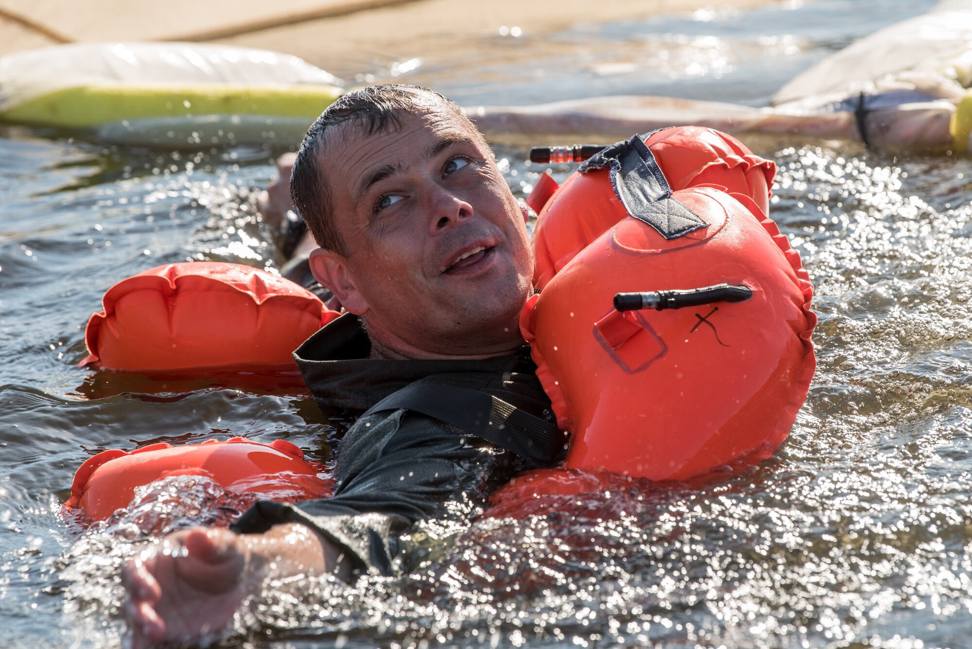 Tech. Sgt. Brian Milburn, a loadmaster for the Kentucky Air National Guard’s 123rd Contingency Response Group, extricates himself from a floating parachute during water survival training at Camp Crooked Creek in Shepherdsville, Ky., Sept. 14, 2019. The training also covered land survival techniques and orienteering. (U.S. Air National Guard photo by Staff Sgt. Joshua Horton)