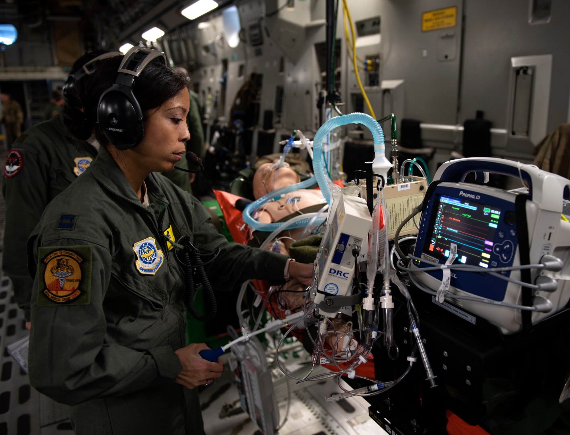 photos of Airmen practicing aeromedical evacuation on a C-17 Globemaster III from Travis AFB, California.