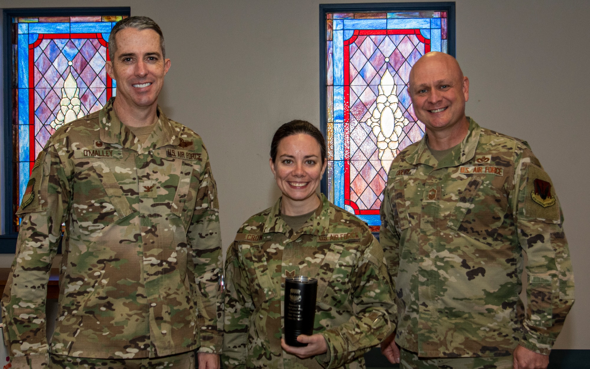 a photo of an Airman being awarded weasel of the week