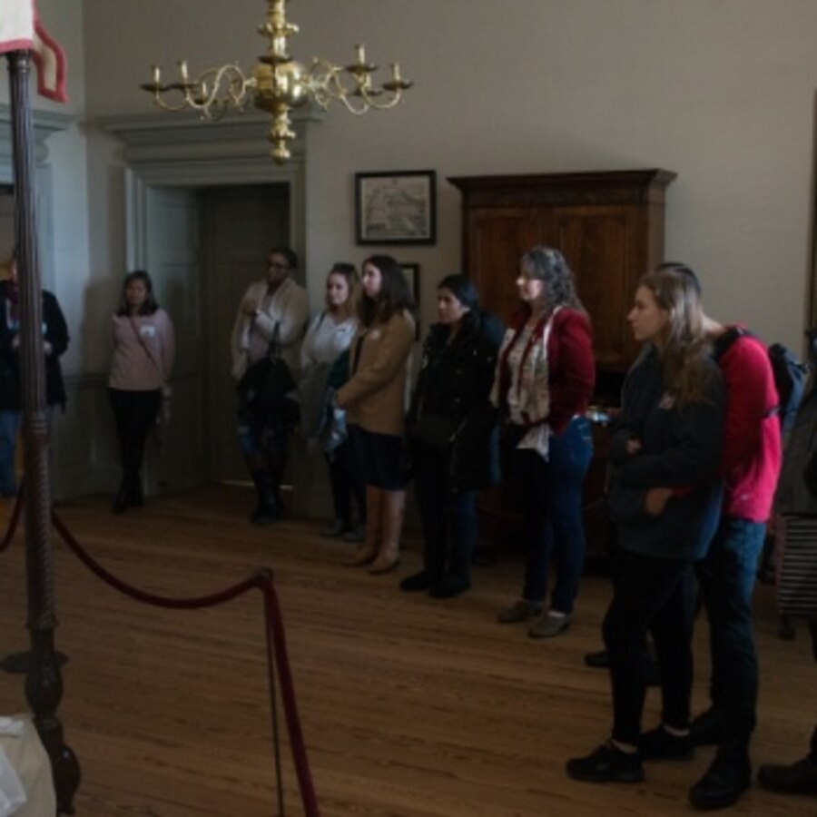 Military spouses view a bedroom display of a colonial era household in the Tyron Palace in New Bern, North Carolina, Dec. 6, 2019, during a tour hosted by the New Bern Chamber of Commerce Military Alliance as part of a Military spouse appreciation event. The attendees got a glimpse of what life was like in the early days of America during their tour. They also learned about the history and culture of historic downtown New Bern. (U.S. Marine Corps photo by Lance Cpl. Michael Neuenhoff)
