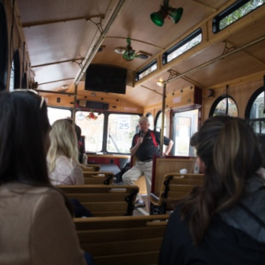 Military spouses listen to their tour guide as they are driven around historic downtown New Bern, North Carolina on Dec. 6, 2019, during a tour hosted by the New Bern Chamber of Commerce Military Alliance as part of a Military spouse appreciation event. The attendees learned about different important figures of both New Bern’s, and the United States', history as they traversed the streets of Historic Downtown New Bern. (U.S. Marine Corps photo by Lance Cpl. Michael Neuenhoff)
