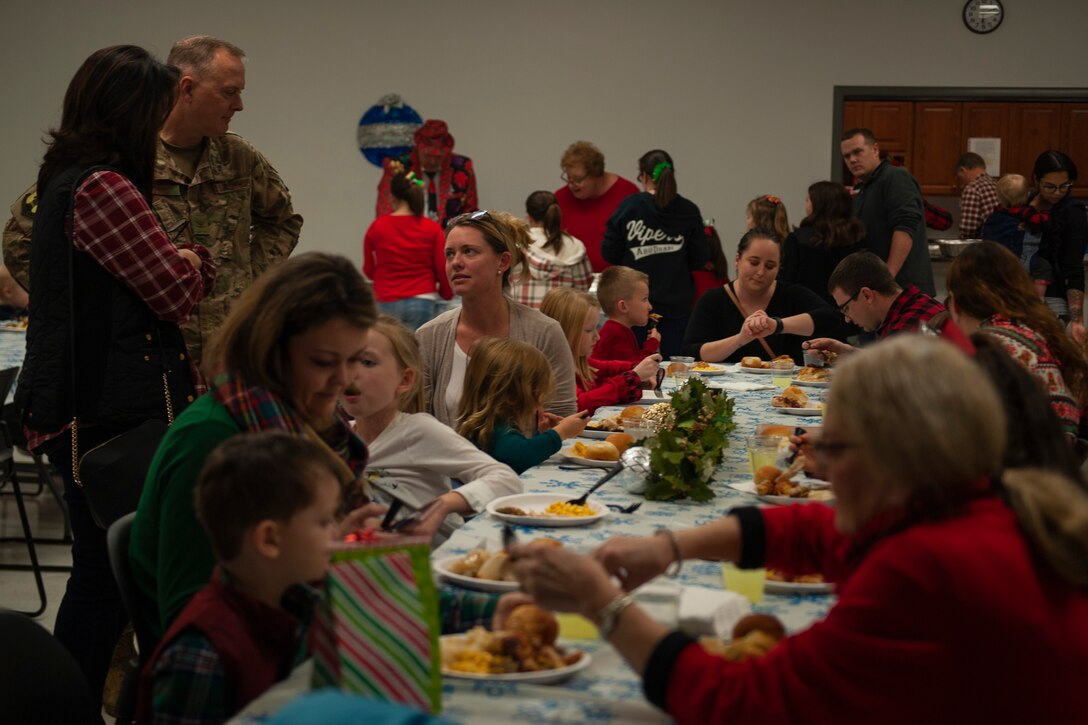 A photo of families at the Holiday Dinner