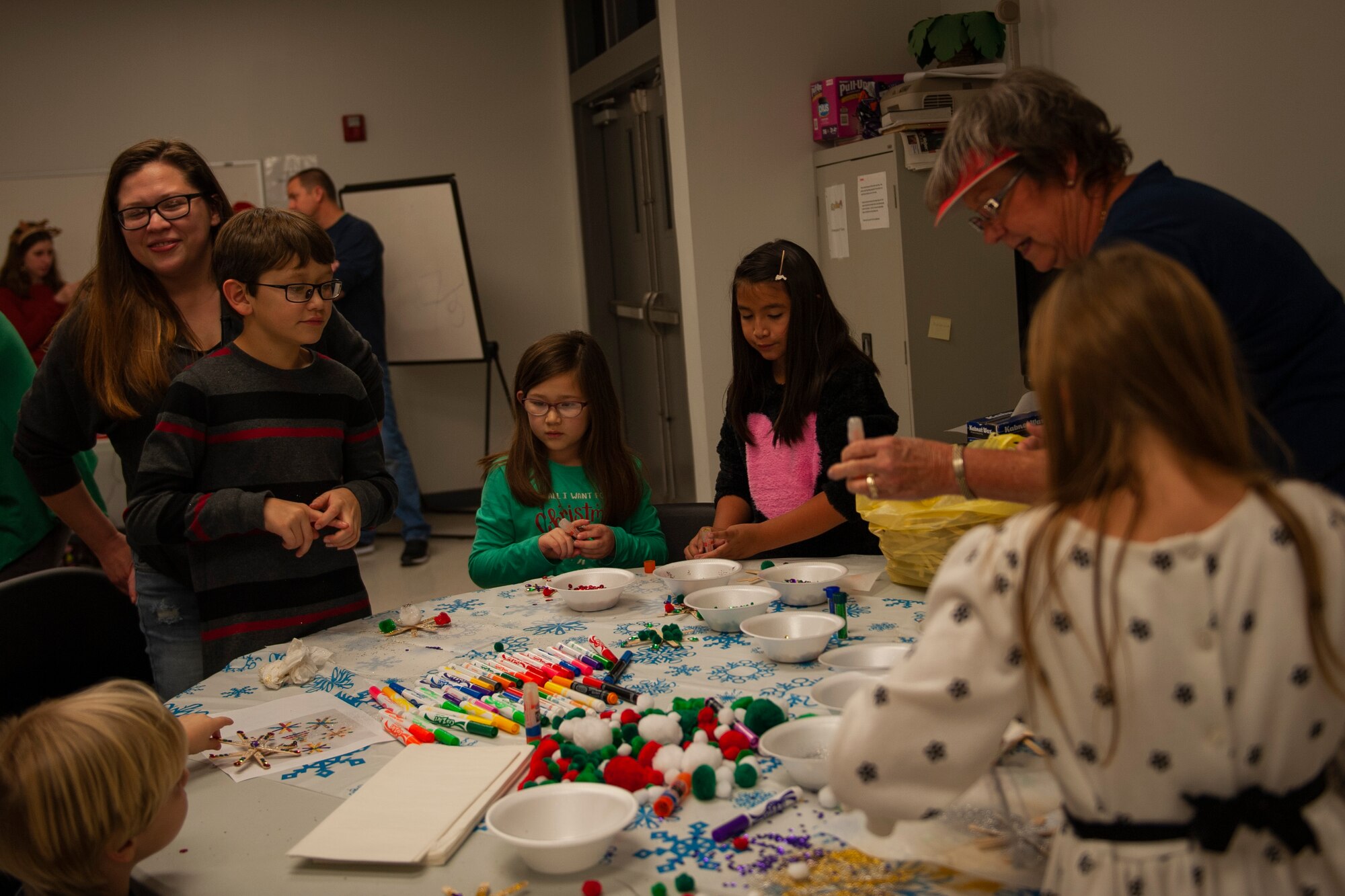 A photo of attendees doing arts and crafts