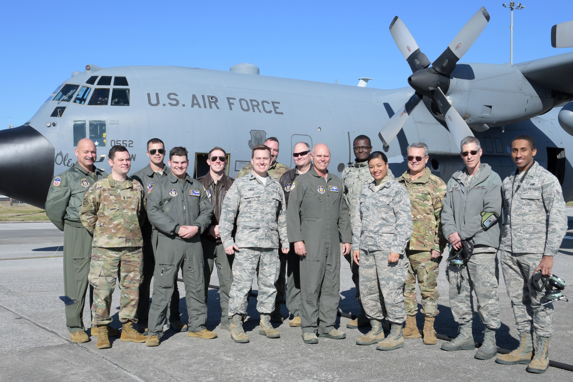 Brig. Gen. Richard Kemble, once the 94th Airlift Wing commander, center, poses for a group photo with the new commander, Col. Craig McPike, and Airmen from Dobbins shortly after landing at Dobbins Air Reserve Base, Ga. on Dec. 20, 2019. The flight marked 6,000 flying hours for Kemble. (U.S. Air Force photo/Tech. Sgt. Andrew Park)