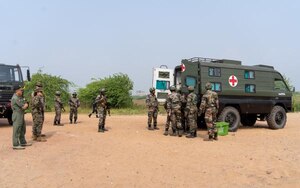 Indian air force’s rapid action medical team unloads a casualty evacuation patient received from the air field-to-field hospital for triage and medical care during a medical subject matter expert exchange in India, Nov. 20, 2019. The SMEE focused on lessons learned and table top exercises on performing humanitarian disaster and relief operations in a post-disaster environment, where roads, air and seaports are no longer accessible due to a natural disaster. (Courtesy photo)