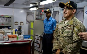 U.S. Air Force Lt. Col. Nelson Pacheco, Pacific Air Forces International Health Specialists critical care nurse, receives an orientation tour on the Indian navy ship Sandhayak during a medical subject matter expert exchange in Visakhapatnam, India, Nov. 16, 2019. The SMEE focused on lessons learned and table top exercises on performing humanitarian disaster and relief operations in a post-disaster environment, where roads, air and seaports are no longer accessible due to a natural disaster. (Courtesy photo)
