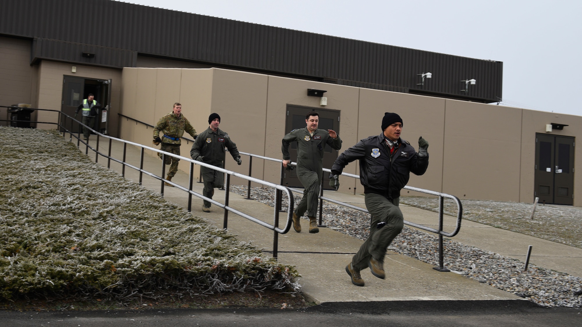 Team Fairchild aircrew Airmen perform a simulated alert response during Exercise Titan Fury at Fairchild Air Force Base, Washington, Dec. 9, 2019.