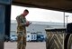 an airman conducts an inspection