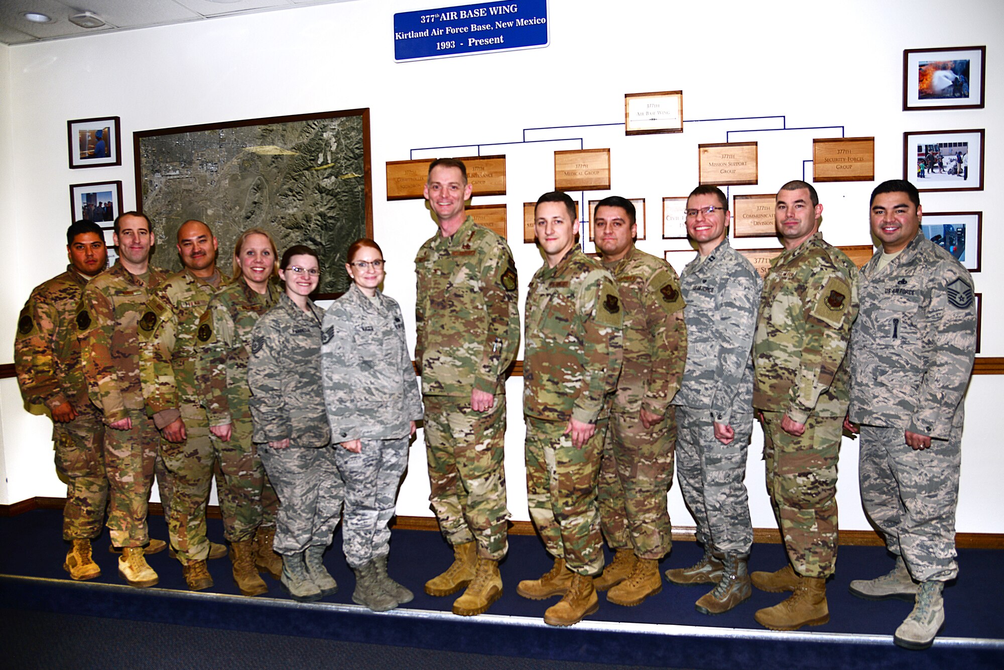 U.S. Air Force Col. David S. Miller, 377th Air Base Wing commander, and Combined Federal Campaign installation executives pose for a group photo to celebrate a successful fundraising season at the 377th headquarters building, Kirtland Air Force Base, N.M., Dec. 20, 2019.