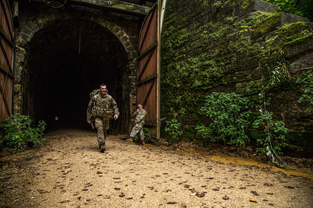 Sgt. Joshua Smith emerges from a tunnel