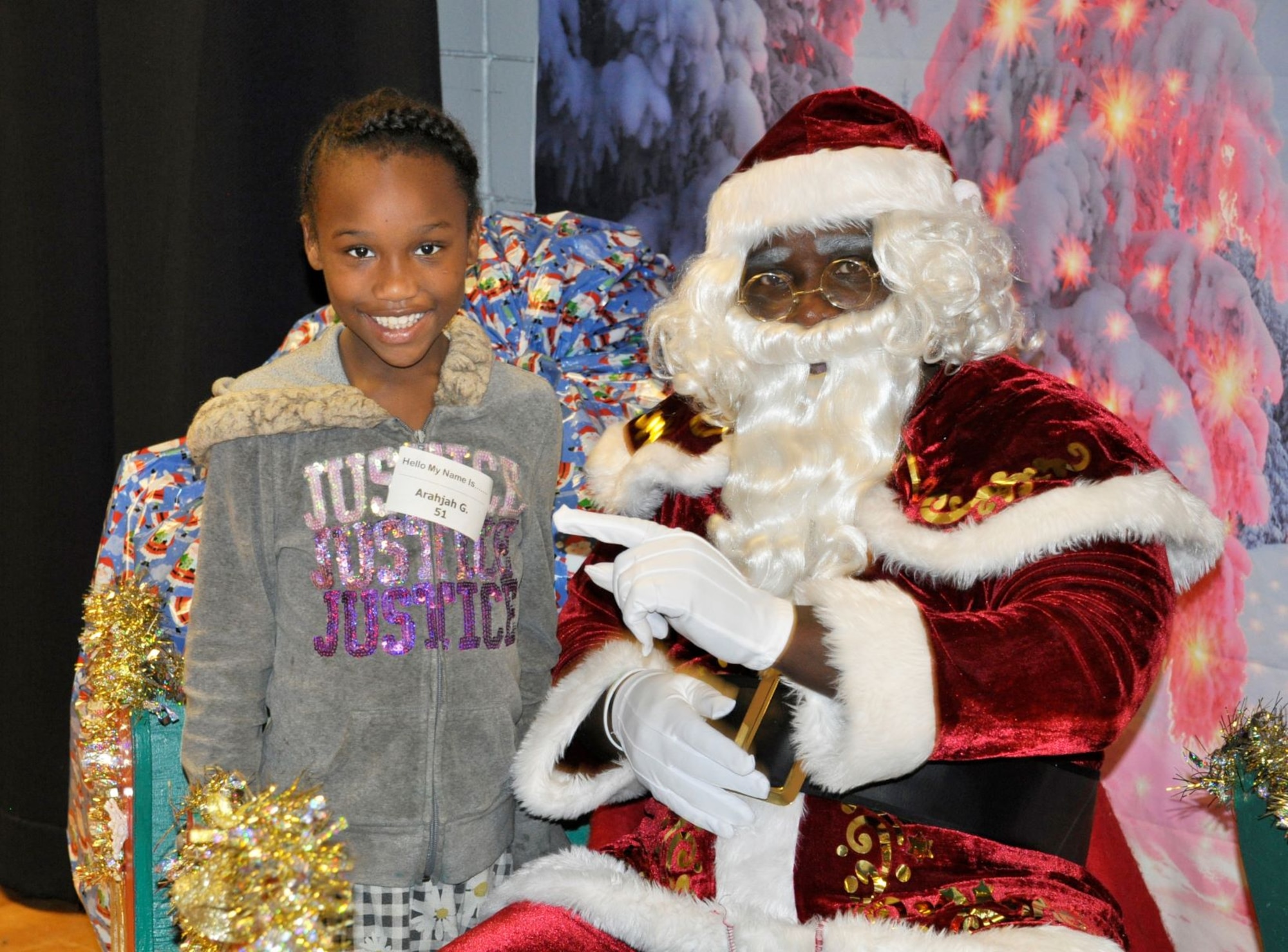 A student visits with Santa Claus Dec. 19 during the annual “Spread the Joy” event sponsored by the Air Force Civil Engineer Center Emergency Management team from Tyndall Air Force Base, Fla.