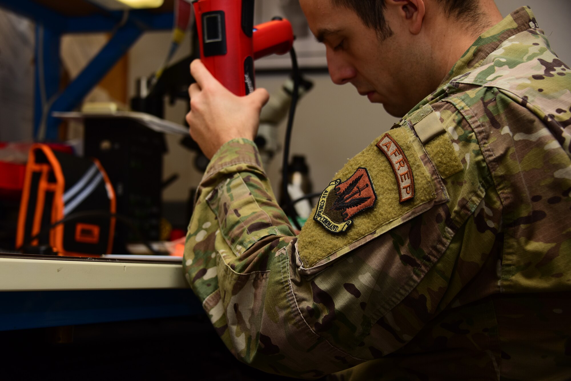 Airman works on equipment