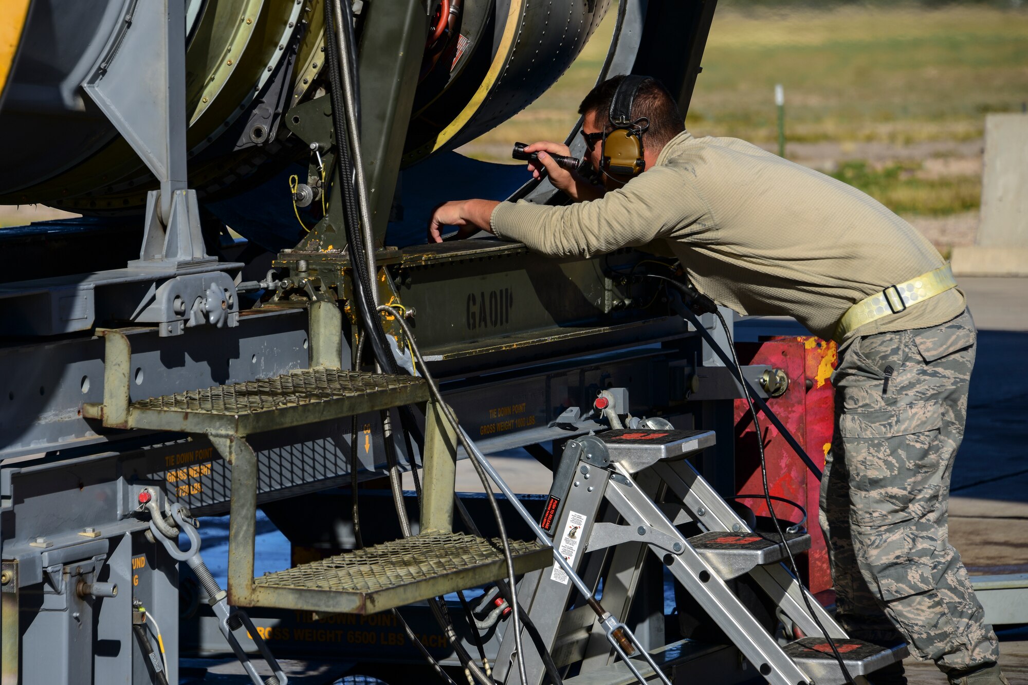 Airman checks engine