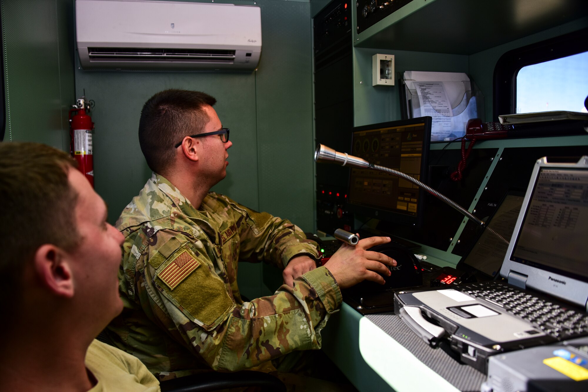 Airmen run tests on an engine