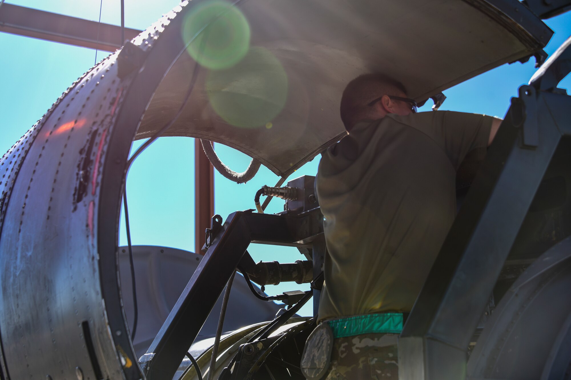 Airman works on an engine