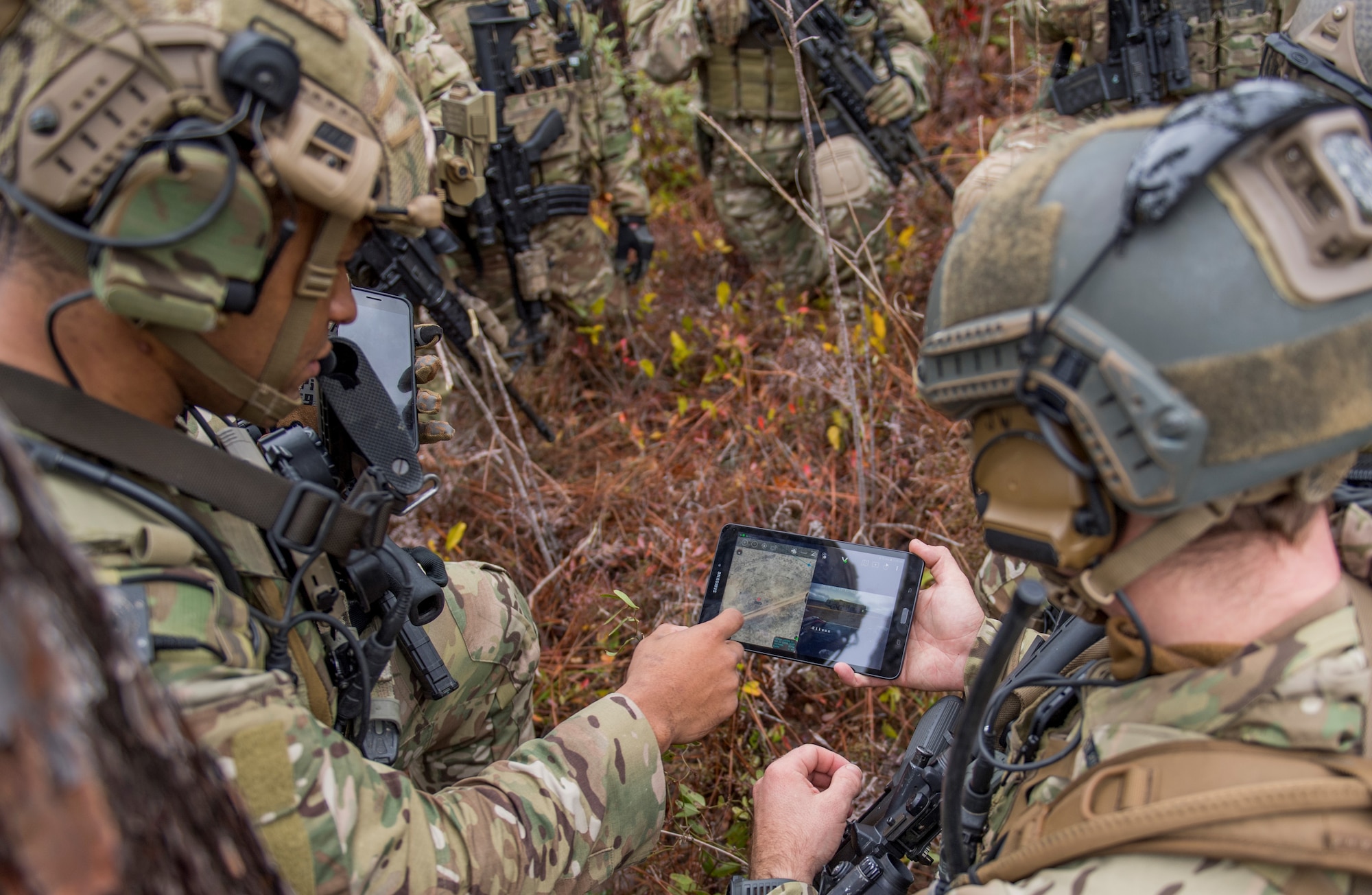 Members of the 6th Special Operations Squadron use a tablet to upload coordinates during an exercise showcasing the capabilities of the Advanced Battle Management System at Duke Field, Fla., Dec. 17, 2019. During the first demonstration of the ABMS, operators across the Air Force, Army, Navy and industry tested multiple real-time data sharing tools and technology in a homeland defense-based scenario enacted by U.S. Northern Command and enabled by Air Force senior leaders. The collection of networked systems and immediately available information is critical to enabling joint service operations across all domains. (U.S. Air Force photo by Tech. Sgt. Joshua J. Garcia)