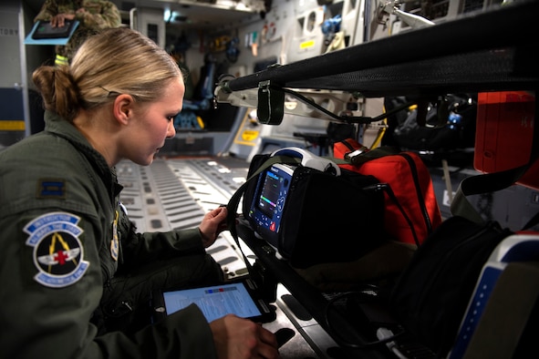 Photo of Airman practicing aeromedical evacuation on a C-17 Globemaster III from Travis Air Force Base, California.