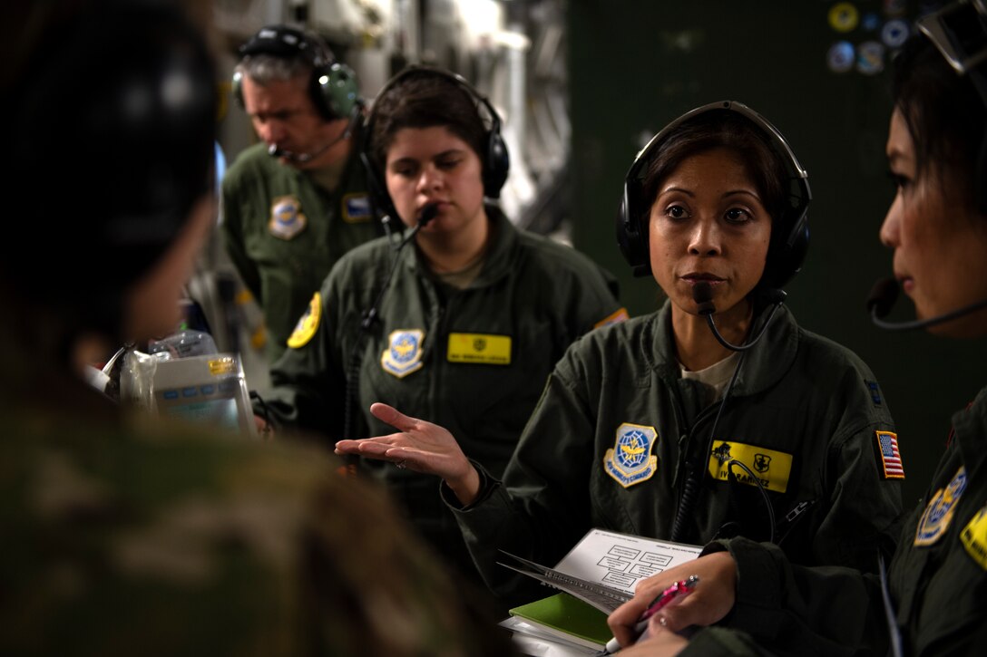 photos of Airmen practicing aeromedical evacuation on a C-17 Globemaster III from Travis AFB, California.