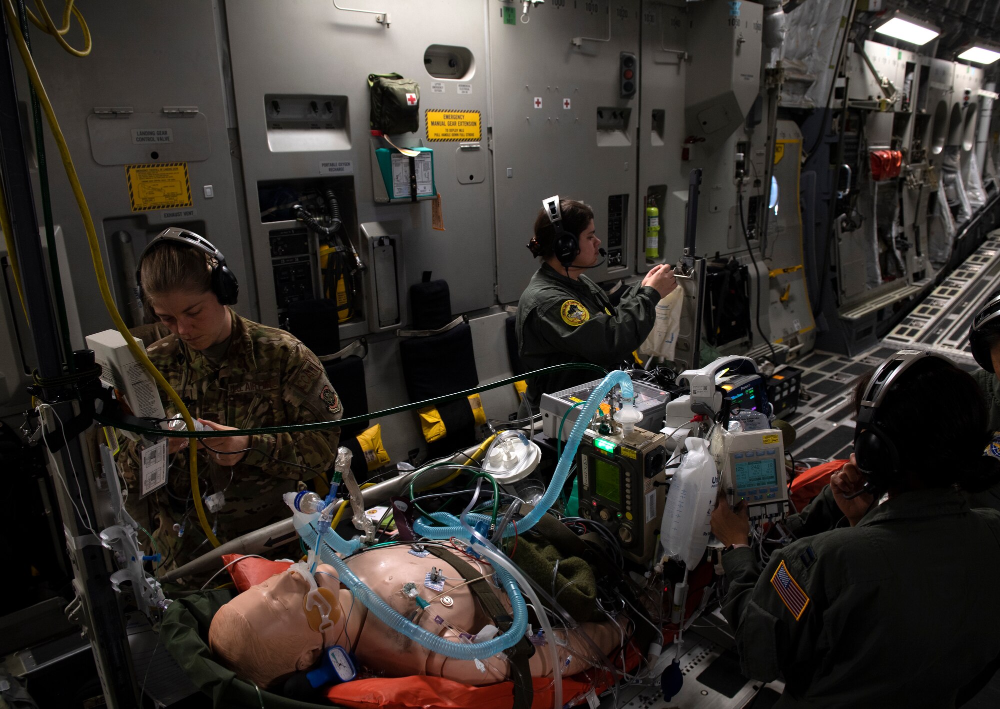photos of Airmen practicing aeromedical evacuation on a C-17 Globemaster III from Travis AFB, California.