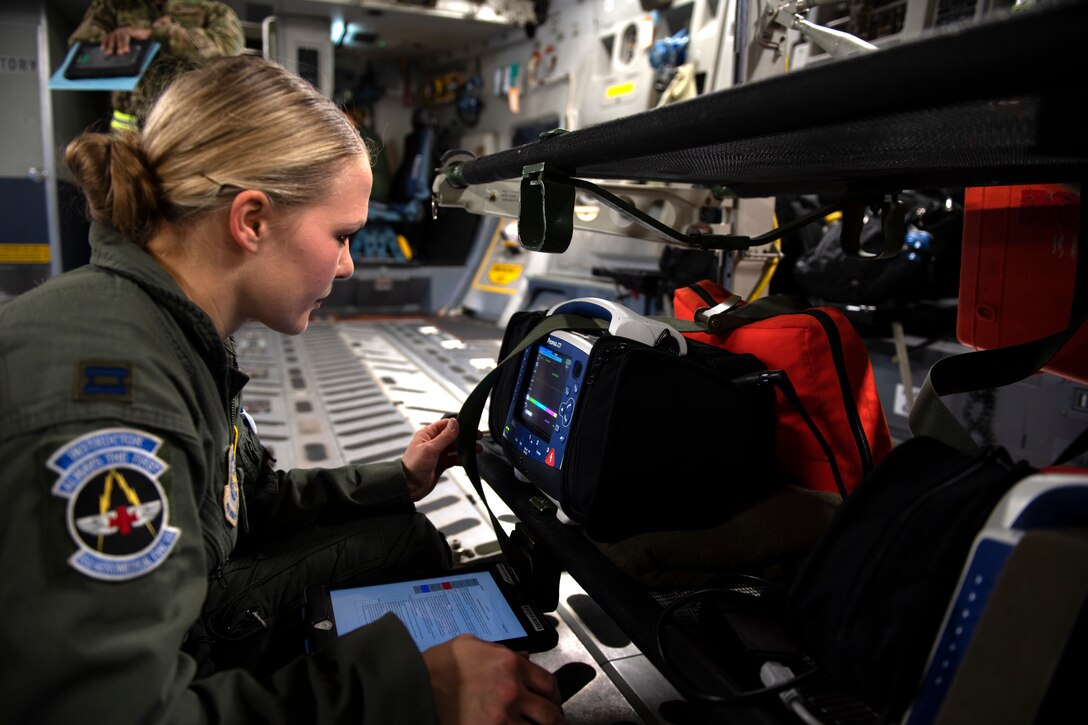 photos of Airmen practicing aeromedical evacuation on a C-17 Globemaster III from Travis AFB, California.